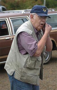 Roy Kirkham, coordinator of the Seaside Museum 19th Annual Parade makes last minutes decisions before parade begins.